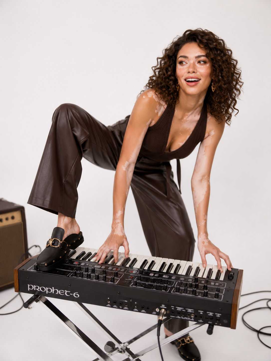 Sophia playing a Prophet-6 synthesizer